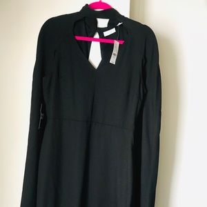 Elegant little black dress with cape detail